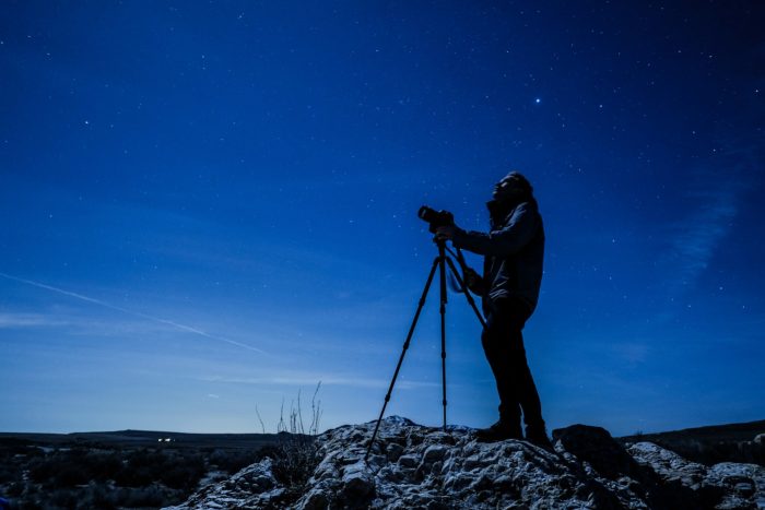 a man stargazing with a telescope at Antelope Island in Utah