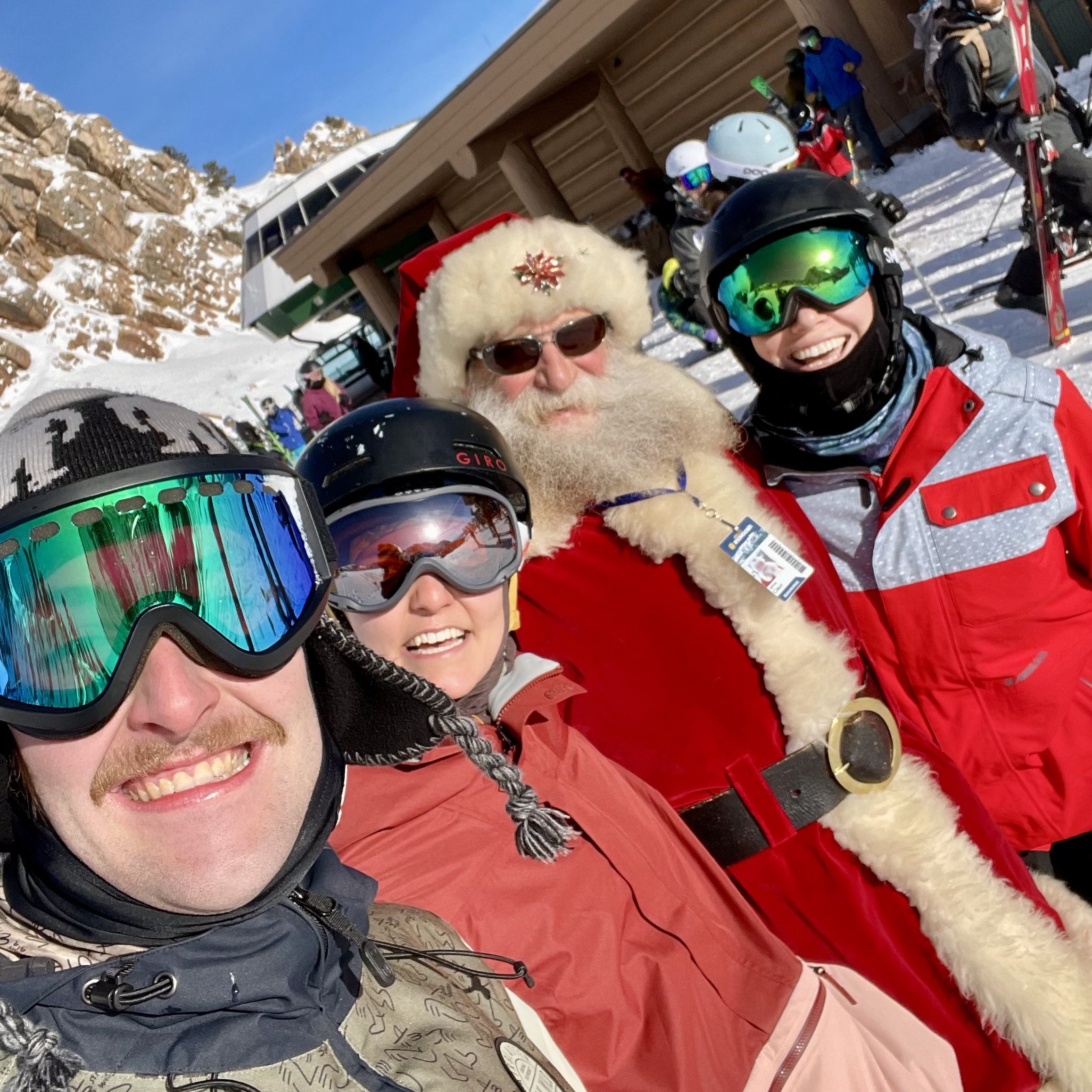 People skiing with Santa Claus at Snowbasin Ski Resort