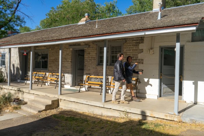 Visitors walking the porch of the historic Fielding Garr Ranch house on Antelope Island